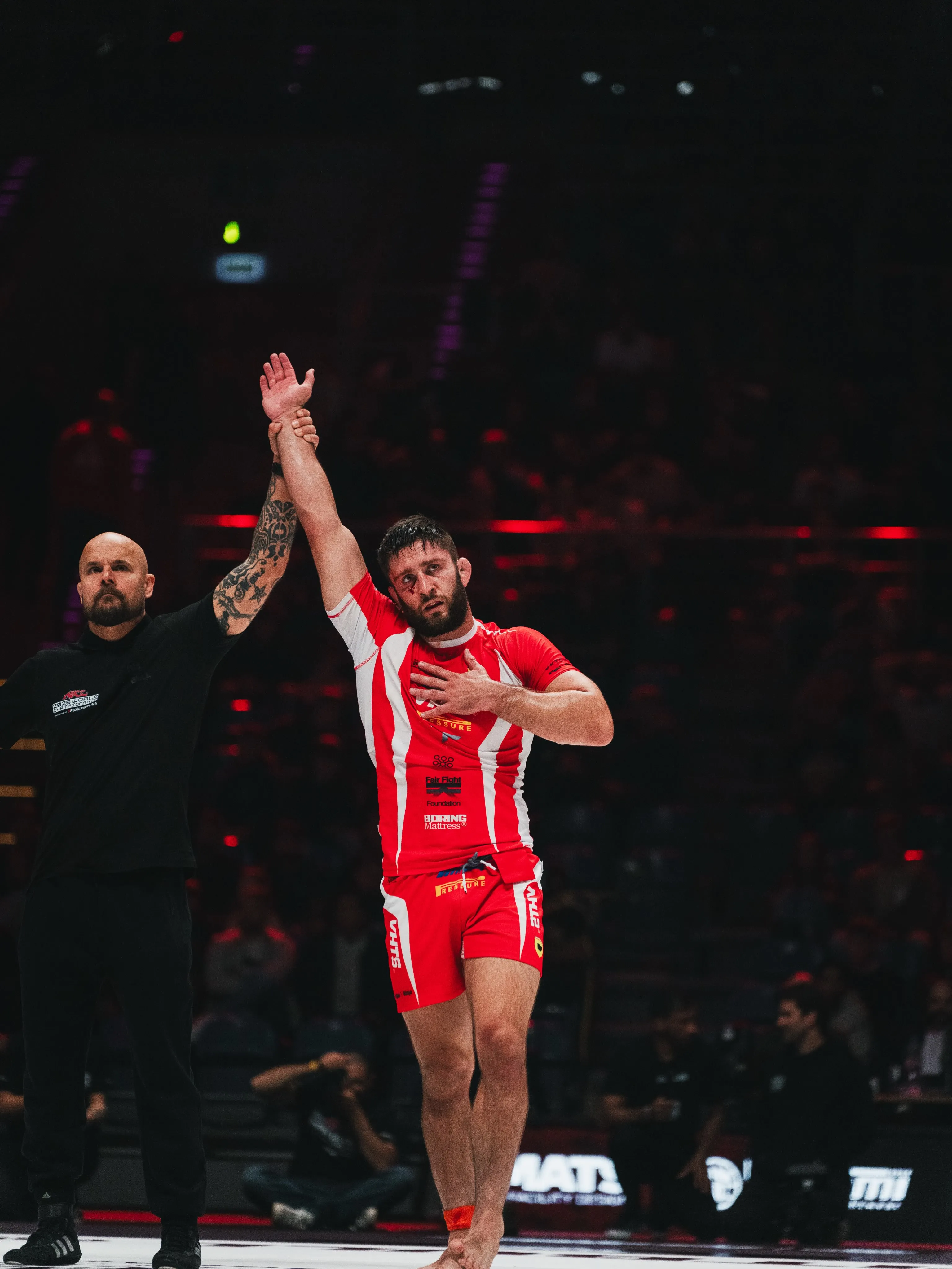 A VHTS Ferrari competitor gets his hand raised VHTS Ferrari rash guard